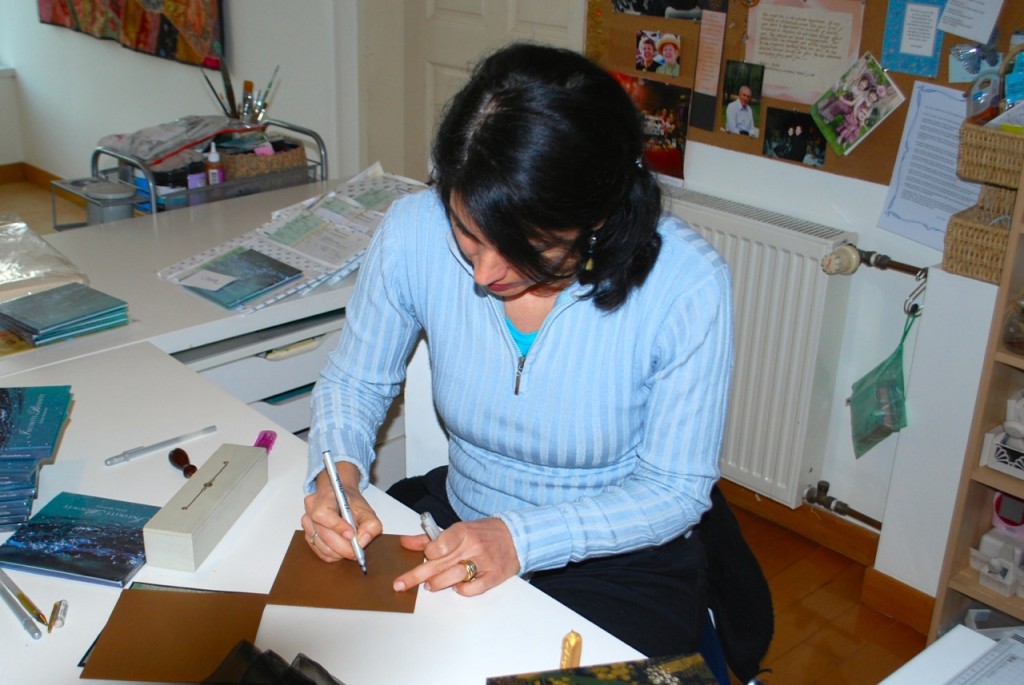 Writing calligraphy of the name of the recipient on the gold envelope