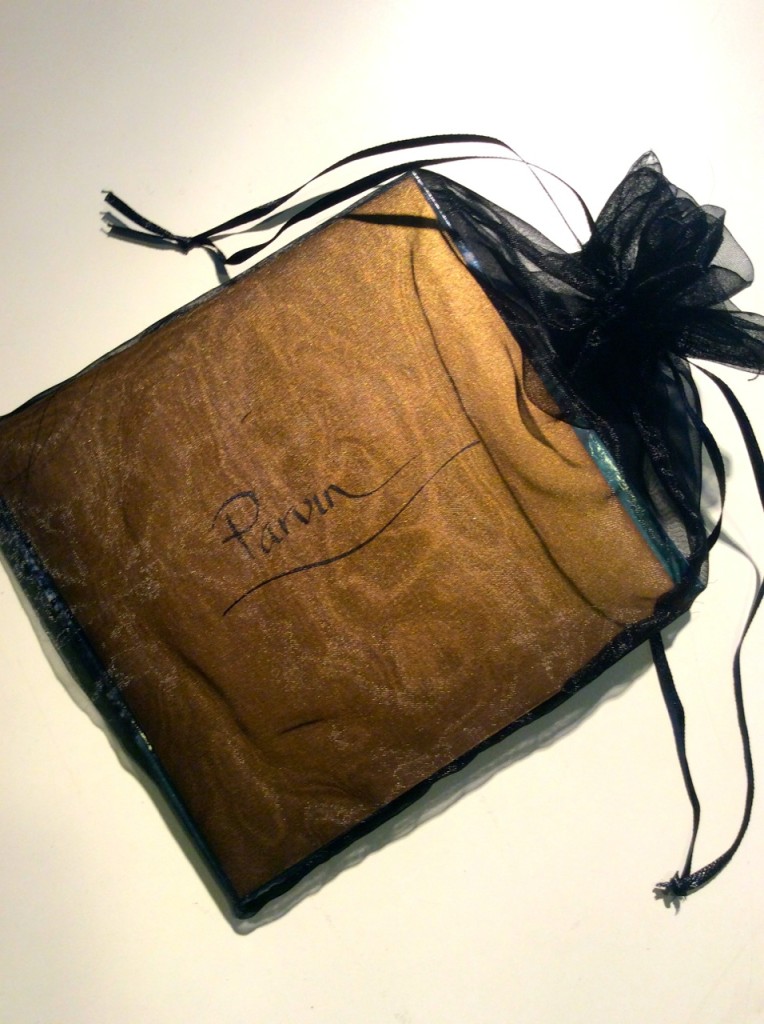 Calligraphy written on the gold envelope for the deluxe edition wrapped in black chiffon